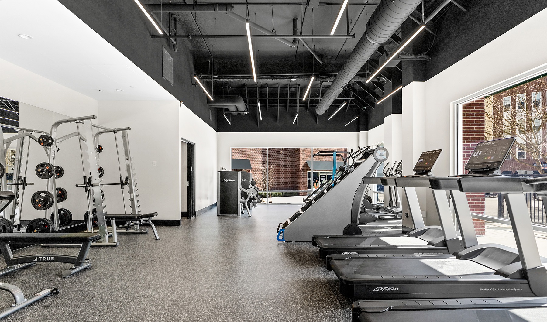 Cutting-edge amenities at your fingertips a gym with exercise equipment