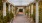 concrete columns holding up pergola covered, pebbled walkway